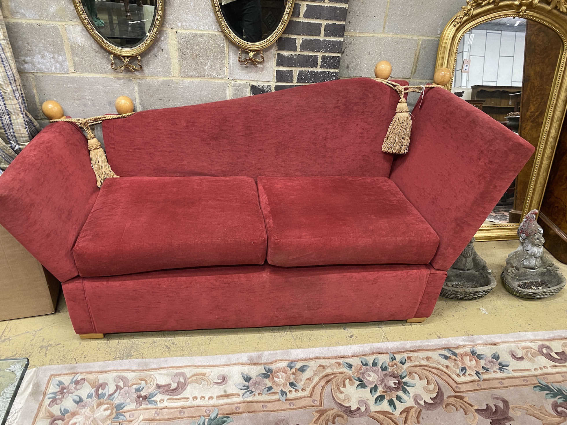 A contemporary Knole settee with red fabric upholstery, length 200cm, depth 82cm, height 105cm